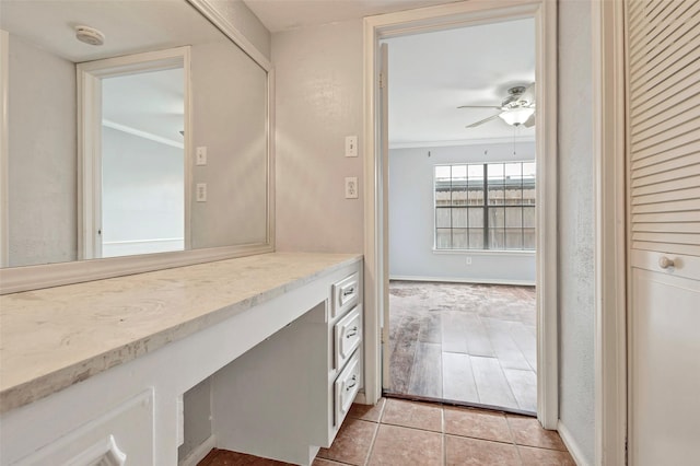 bathroom with crown molding, tile patterned floors, and ceiling fan