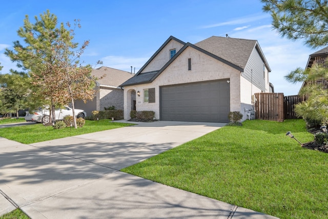 view of front of house with a garage and a front yard