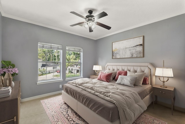 bedroom featuring crown molding, light carpet, and ceiling fan