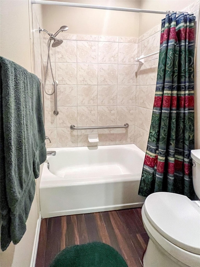 bathroom featuring shower / tub combo with curtain, hardwood / wood-style floors, and toilet