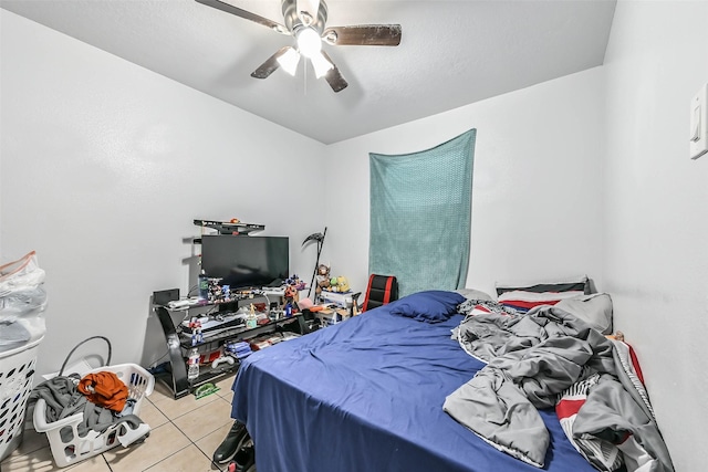 bedroom featuring light tile patterned floors and ceiling fan