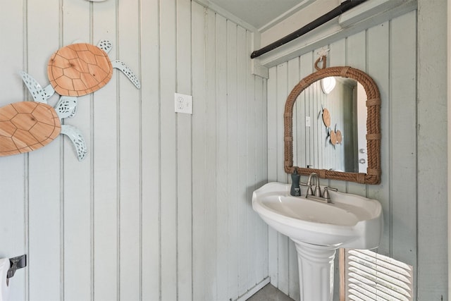 bathroom with wood walls