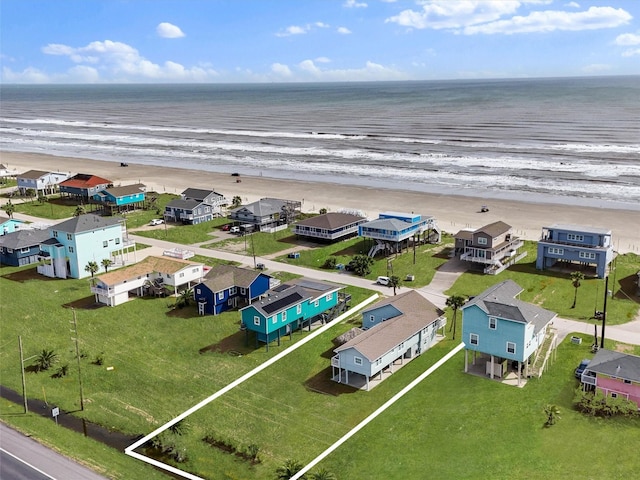 bird's eye view featuring a beach view and a water view