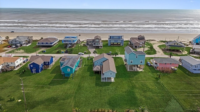 bird's eye view with a water view and a view of the beach