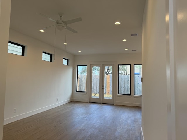 empty room with wood-type flooring and ceiling fan