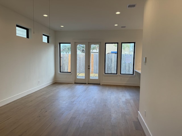 spare room featuring wood-type flooring