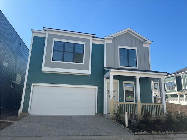 view of front of property with a garage and a porch