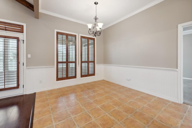 unfurnished room featuring a wealth of natural light, ornamental molding, and a chandelier