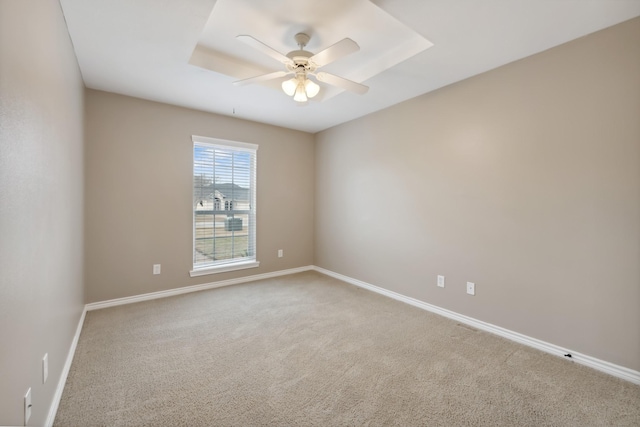 unfurnished room featuring ceiling fan and carpet