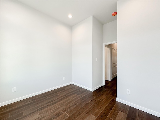 empty room featuring dark hardwood / wood-style floors