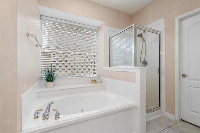 bathroom featuring tile patterned floors and independent shower and bath