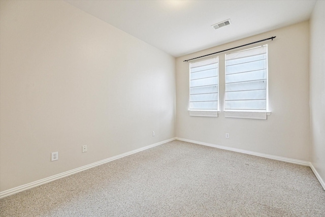 empty room featuring carpet flooring