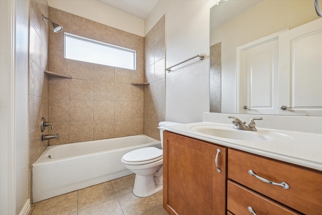 full bathroom with tile patterned flooring, vanity, toilet, and tiled shower / bath