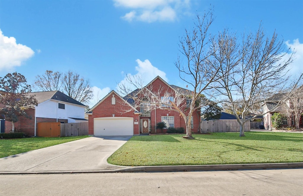 view of front of home with a garage and a front yard