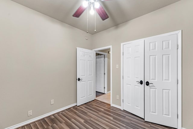 unfurnished bedroom featuring ceiling fan, hardwood / wood-style floors, and a closet