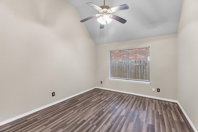 empty room with vaulted ceiling, ceiling fan, and dark hardwood / wood-style flooring