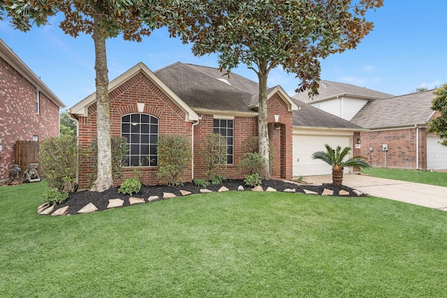 front facade with a garage and a front yard