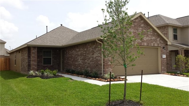 view of front of home with a garage and a front yard