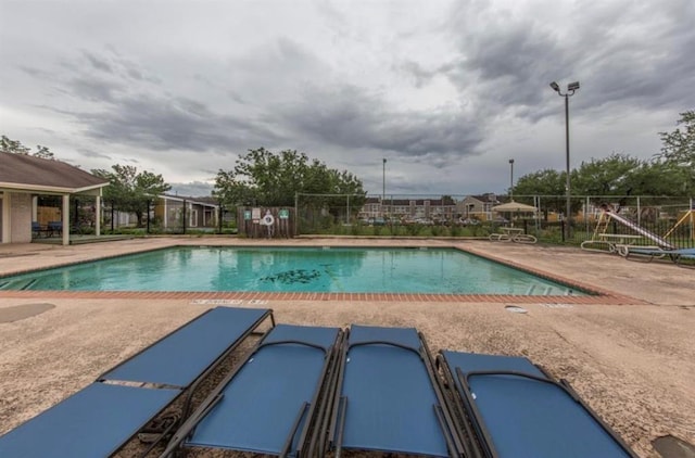 view of swimming pool featuring a patio area