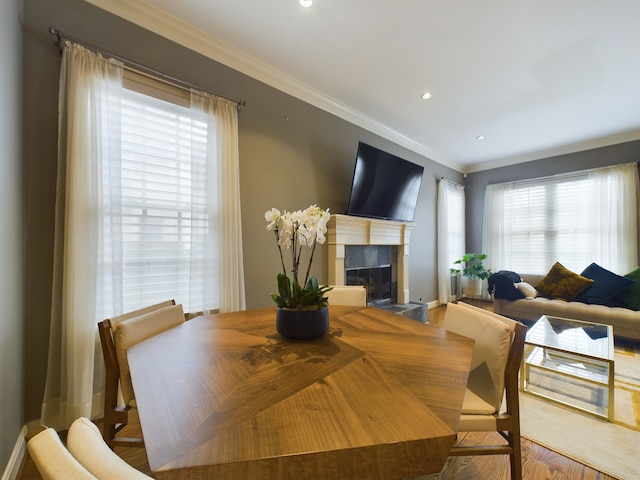 dining room featuring ornamental molding and wood-type flooring