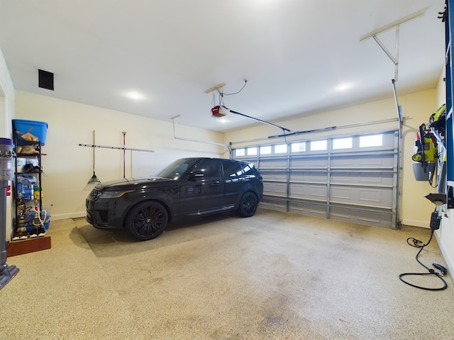 garage featuring a garage door opener