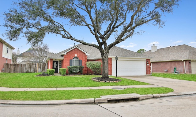 view of front facade featuring a garage and a front lawn