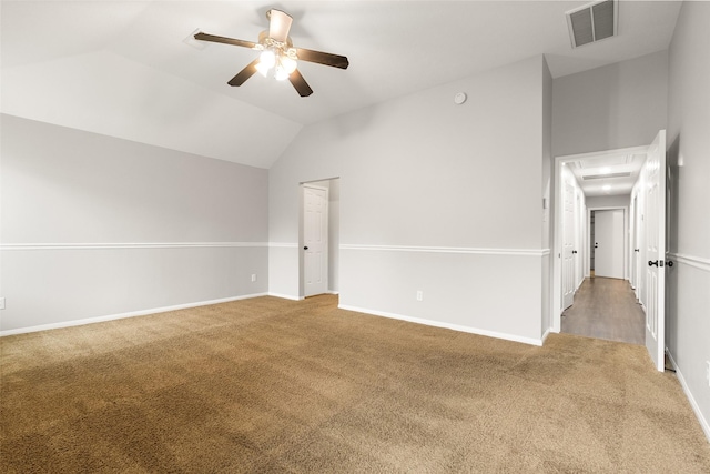 carpeted spare room with lofted ceiling and ceiling fan