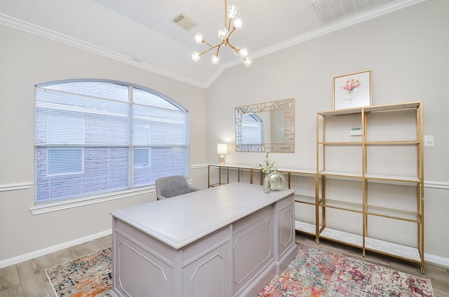 office space with vaulted ceiling, ornamental molding, a chandelier, and light hardwood / wood-style floors