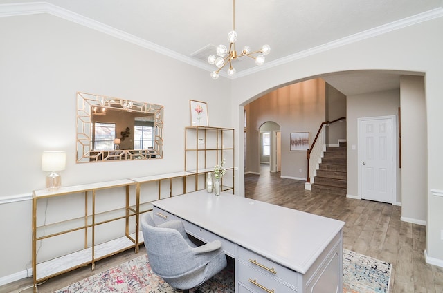 office area with crown molding, plenty of natural light, hardwood / wood-style floors, and an inviting chandelier