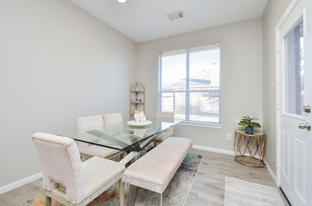 dining space with light wood-type flooring