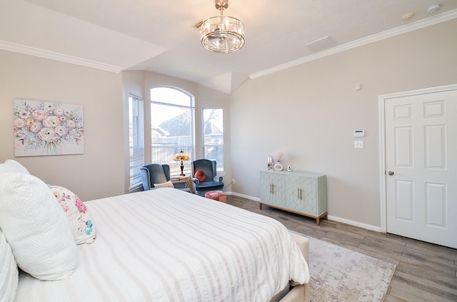 bedroom with crown molding, wood-type flooring, and an inviting chandelier