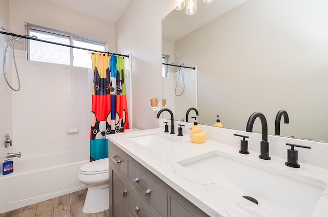 full bathroom with vanity, hardwood / wood-style flooring, toilet, and shower / bathtub combination with curtain