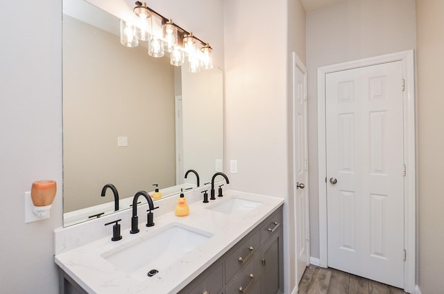 bathroom featuring hardwood / wood-style flooring and vanity