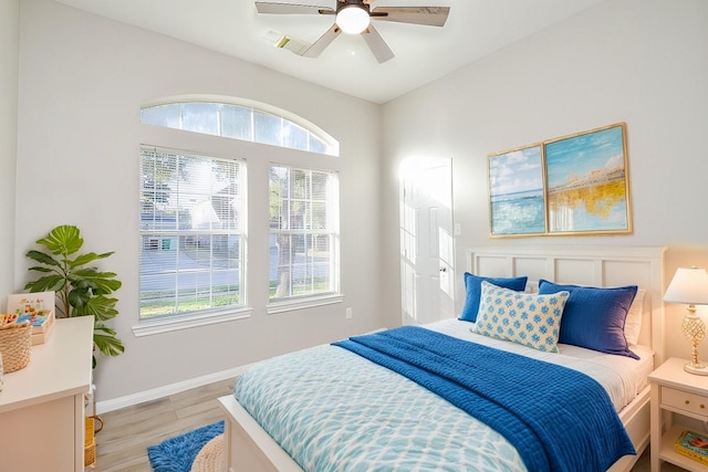 bedroom with ceiling fan and light wood-type flooring