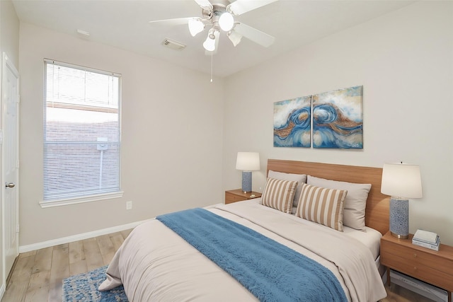 bedroom featuring ceiling fan and light wood-type flooring