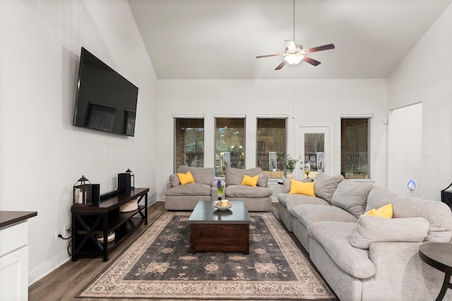 living room featuring ceiling fan, dark hardwood / wood-style flooring, and high vaulted ceiling