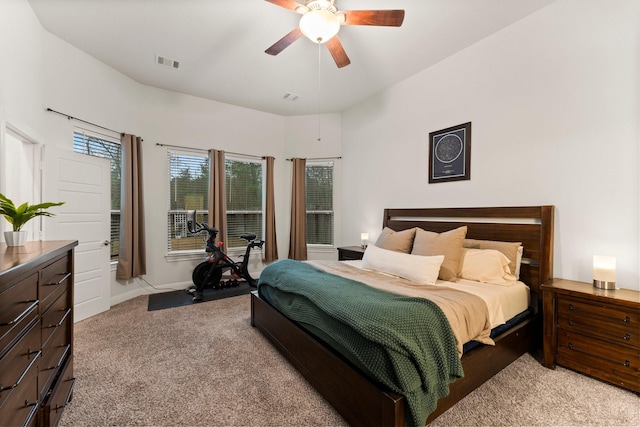 bedroom with ceiling fan and light colored carpet