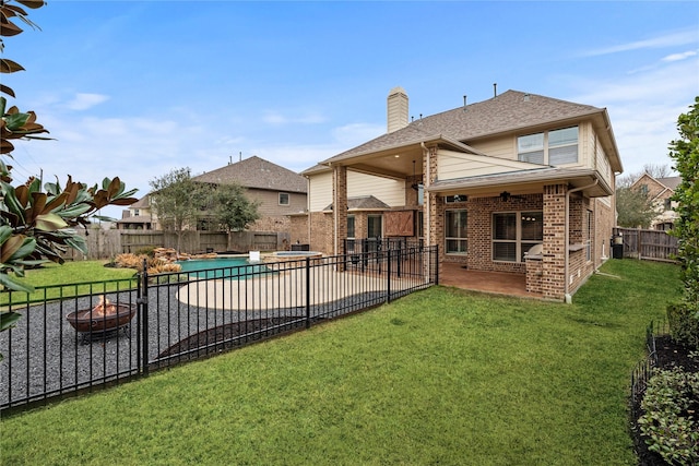 view of swimming pool with an outdoor fire pit, a fenced in pool, a fenced backyard, and a patio