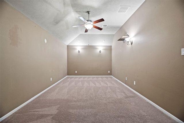 bonus room with light carpet, baseboards, visible vents, a ceiling fan, and vaulted ceiling