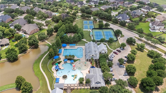 birds eye view of property with a residential view