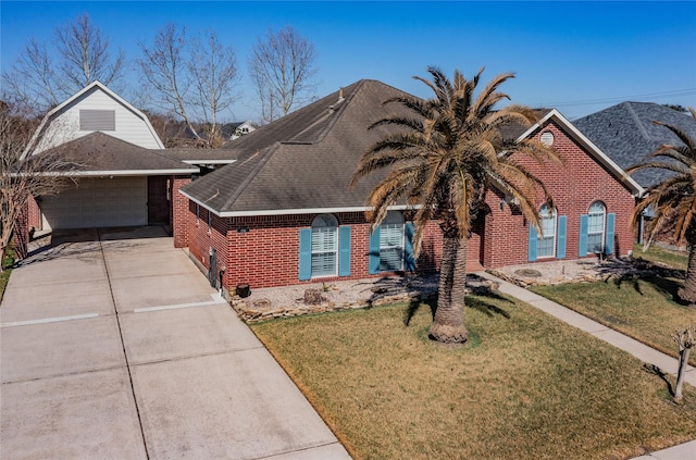 view of front facade featuring a garage, concrete driveway, a gambrel roof, a front lawn, and brick siding