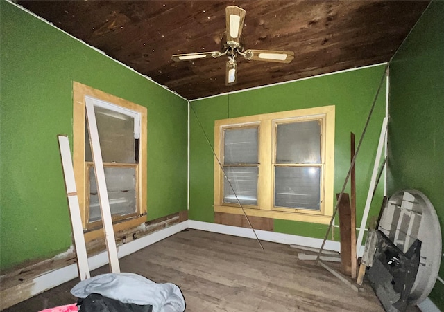 spare room with hardwood / wood-style flooring, ceiling fan, and wooden ceiling