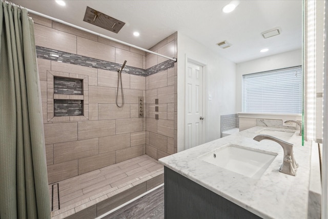 bathroom with vanity, a shower with shower curtain, and wood-type flooring