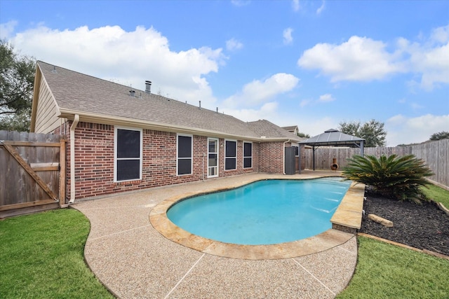 view of swimming pool with a gazebo and a patio area