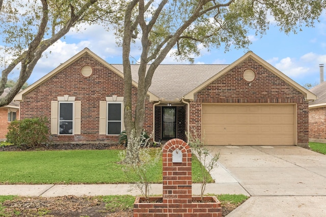 view of front property featuring a garage and a front lawn