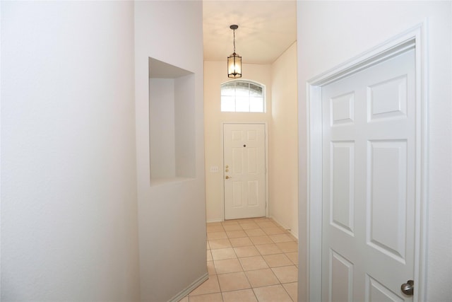 entryway with light tile patterned flooring