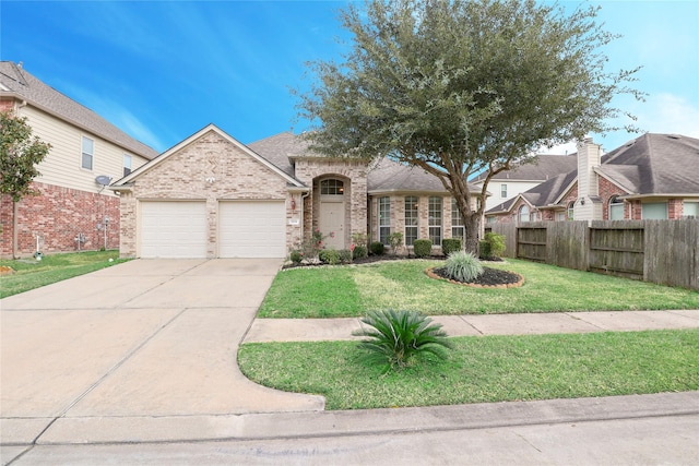 view of front of home featuring a garage and a front lawn