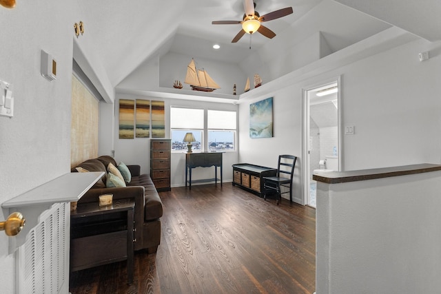 sitting room featuring ceiling fan, lofted ceiling, and dark hardwood / wood-style flooring