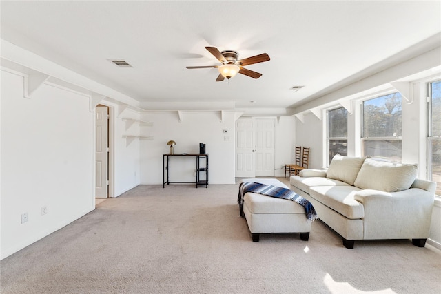 living room featuring light colored carpet and ceiling fan