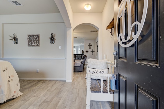 foyer with light hardwood / wood-style flooring